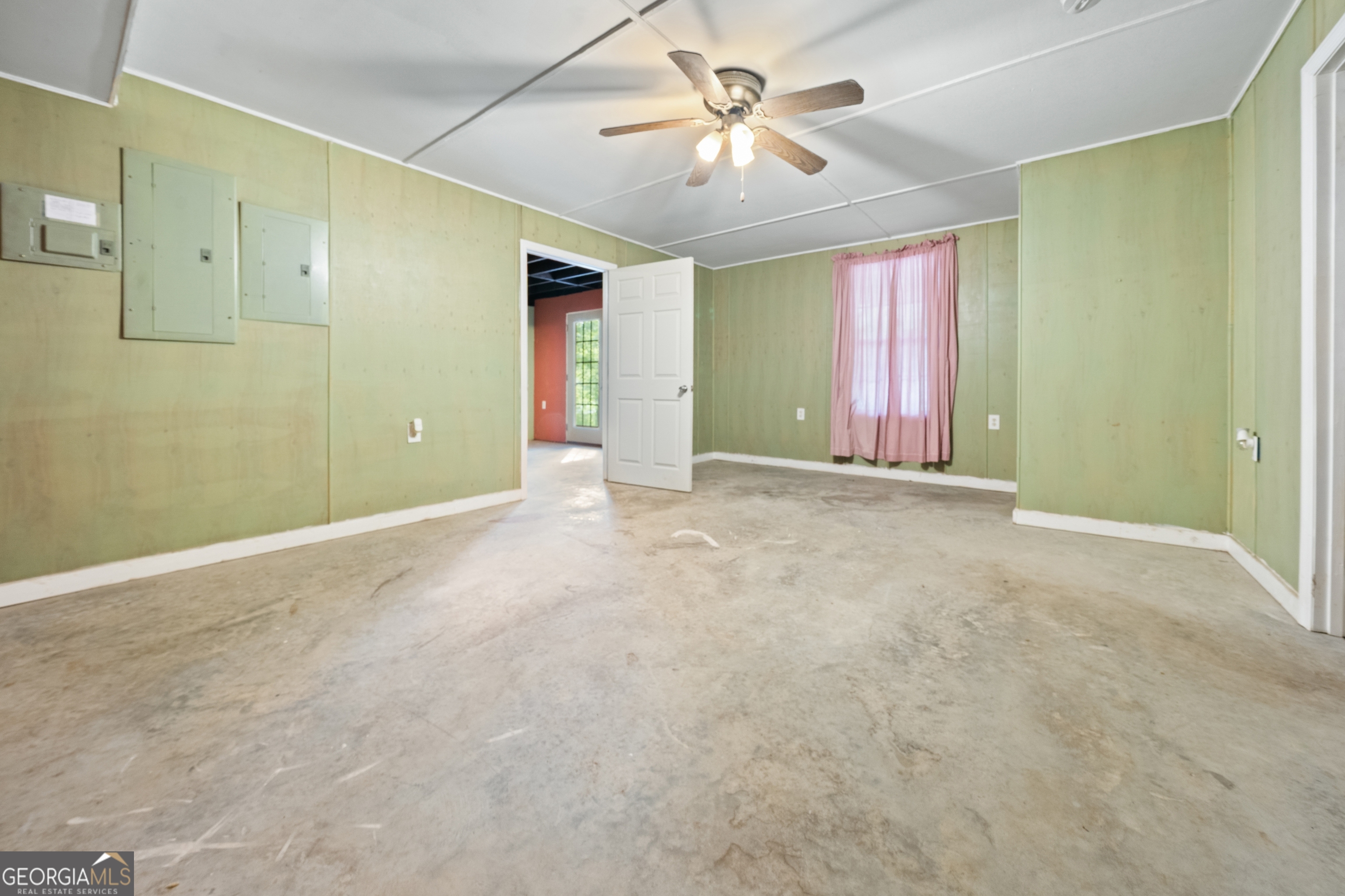 3719 County Road 88 Delta, AL 36258 - Photo 28 of 36 an empty room with windows and fan