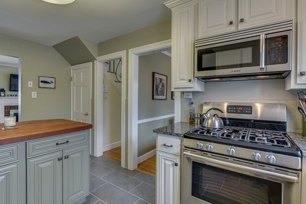 63 Brook Road Marblehead, MA 01945 - Photo 8 of 25 a kitchen with stainless steel appliances granite countertop a stove and a microwave