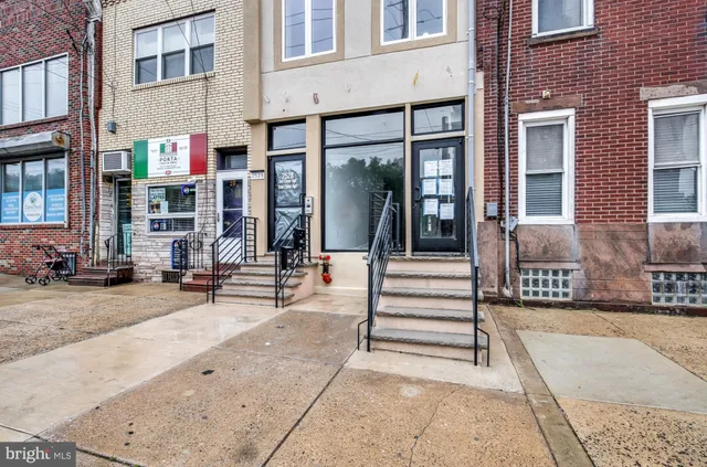a view of a building with sitting area