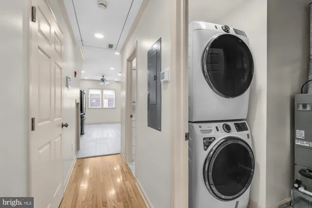 a view of a hallway with washer and dryer