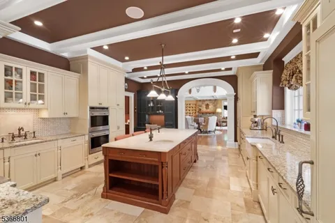 a large space with a large pool table and chairs