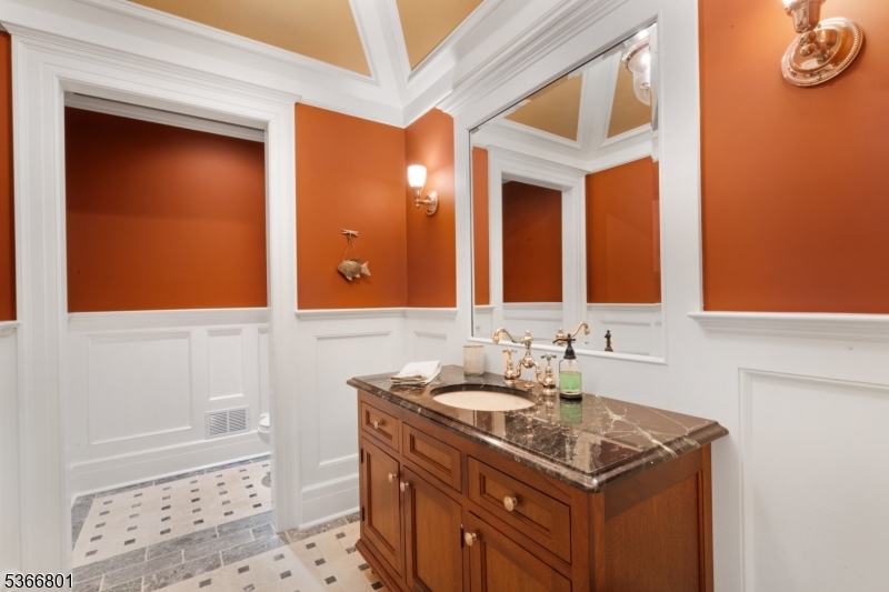 4 Rainetree Ridge Mendham Township, NJ 07945 - Photo 20 of 49 a bathroom with a sink and a mirror