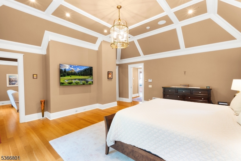 4 Rainetree Ridge Mendham Township, NJ 07945 - Photo 25 of 49 a bedroom with a bed and a flat screen tv