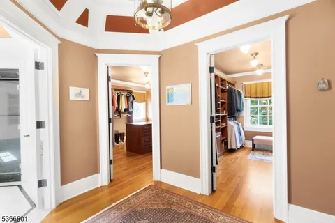 a view of a hallway view with living room and dining room