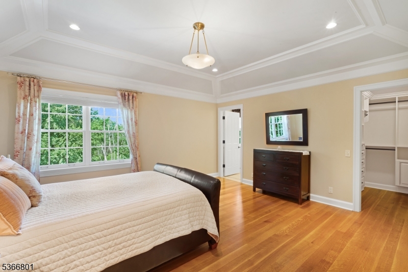 4 Rainetree Ridge Mendham Township, NJ 07945 - Photo 31 of 49 a bedroom with a bed and a window