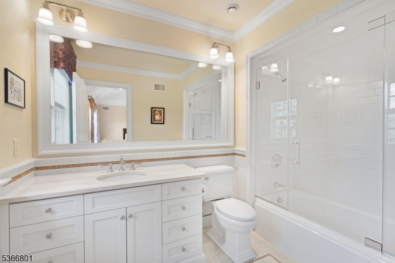 4 Rainetree Ridge Mendham Township, NJ 07945 - Photo 33 of 49 a bathroom with a sink a toilet and a bathtub