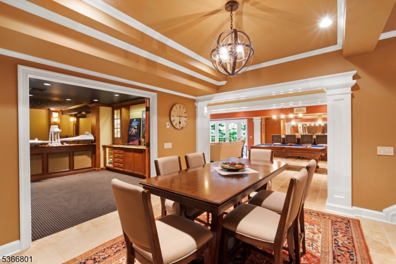 4 Rainetree Ridge Mendham Township, NJ 07945 - Photo 37 of 49 a view of a dining room with furniture wooden floor and chandelier