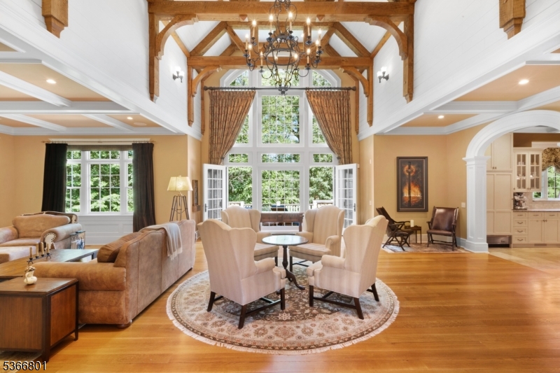 4 Rainetree Ridge Mendham Township, NJ 07945 - Photo 7 of 49 a living room with fireplace furniture and a large window