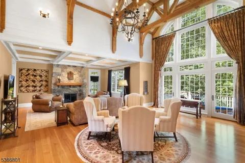 a view of a livingroom with furniture window and wooden floor