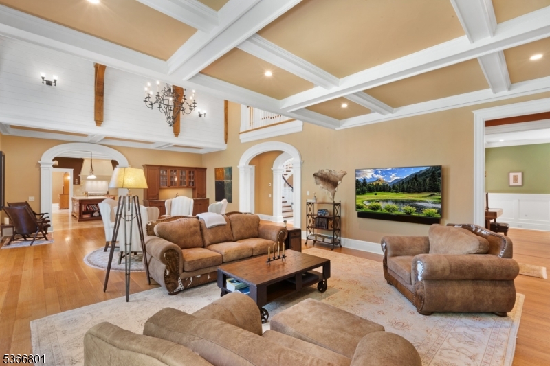 4 Rainetree Ridge Mendham Township, NJ 07945 - Photo 10 of 49 a living room with furniture and a flat screen tv