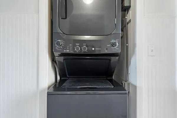 a view of a room with cabinet and wooden floor