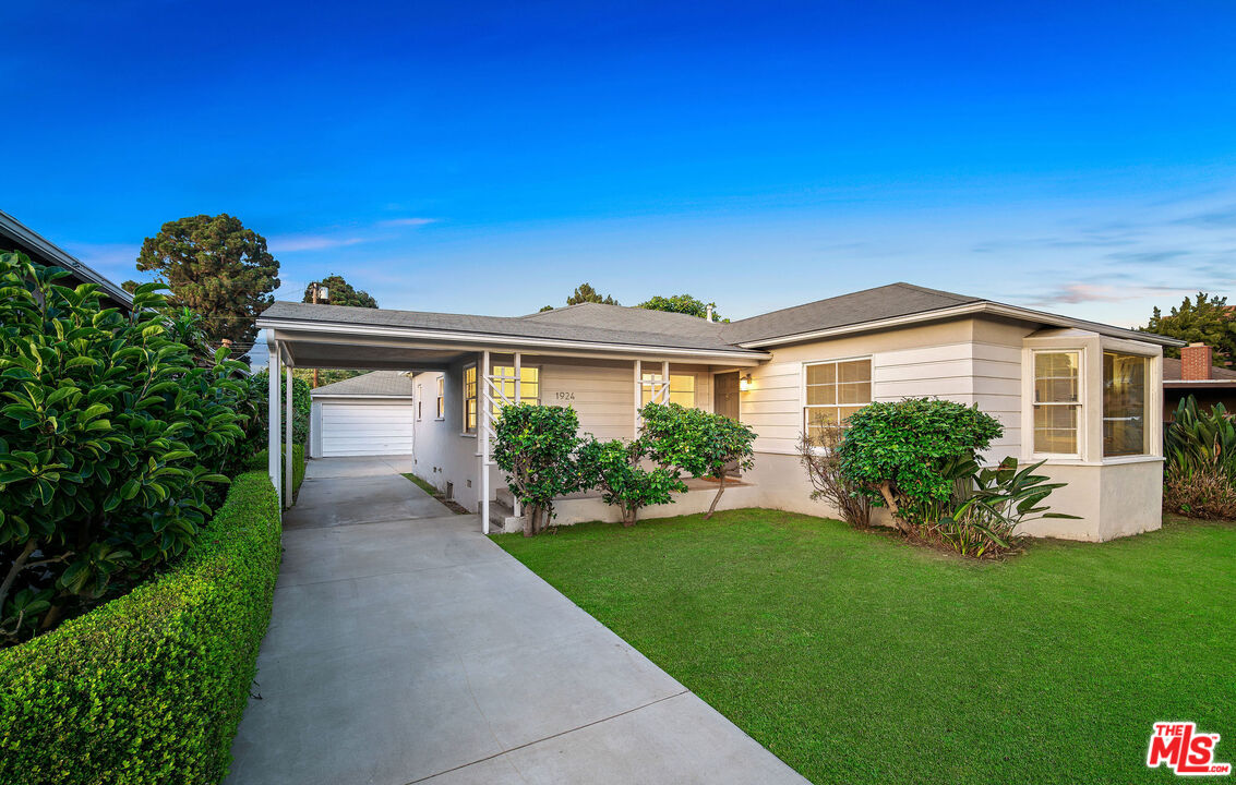 1924 Armacost Avenue Los Angeles, CA 90025 - Photo 2 of 33 a view of a house with a yard
