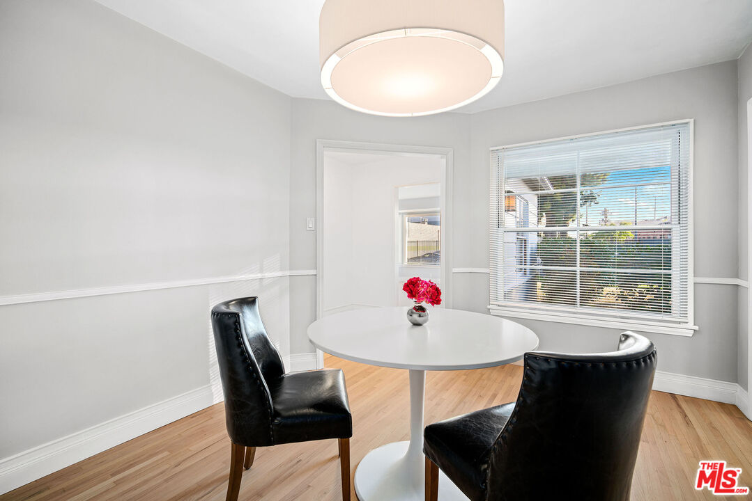 1924 Armacost Avenue Los Angeles, CA 90025 - Photo 12 of 33 a view of a dining room with a table and chairs