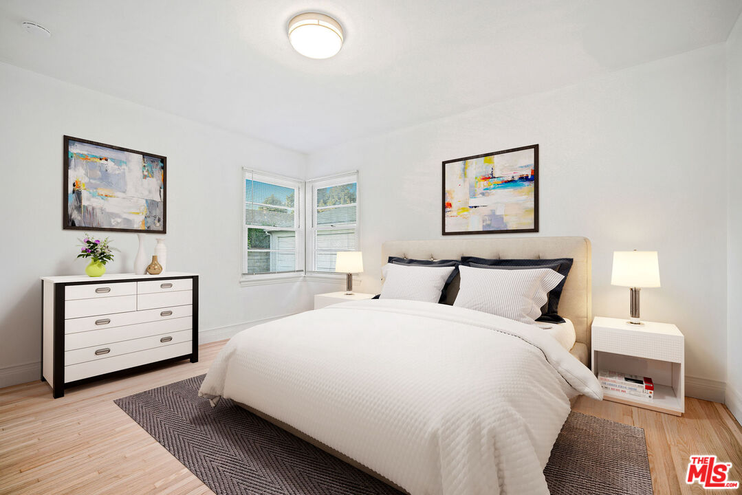 1924 Armacost Avenue Los Angeles, CA 90025 - Photo 21 of 33 a bedroom with a bed and a dresser