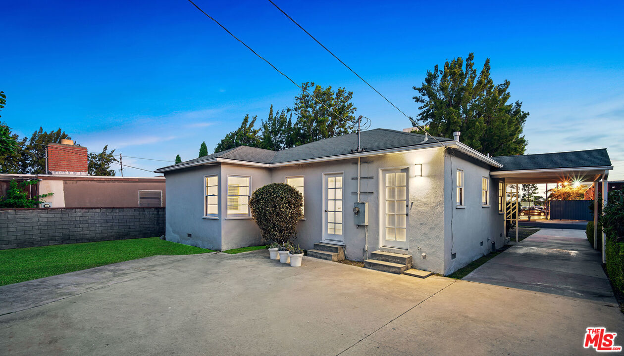 1924 Armacost Avenue Los Angeles, CA 90025 - Photo 33 of 33 a view of a house with backyard and a garage