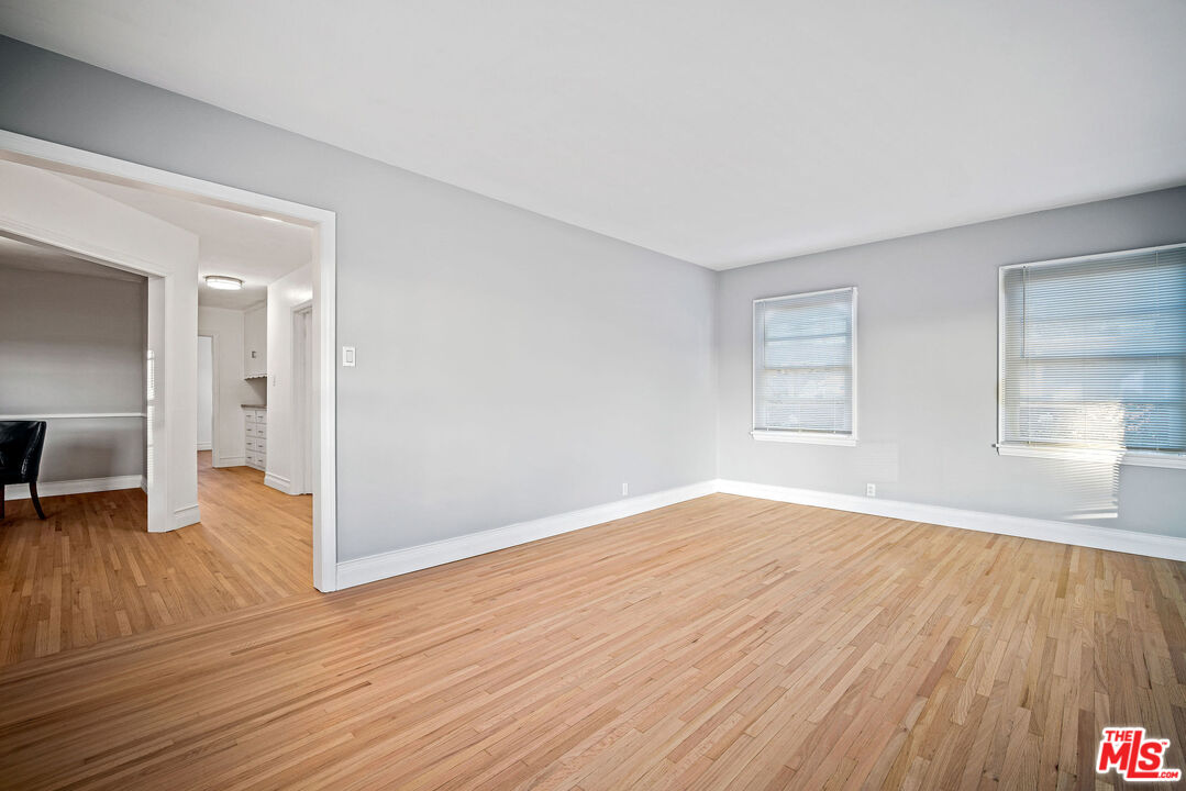 1924 Armacost Avenue Los Angeles, CA 90025 - Photo 10 of 33 a view of empty room with wooden floor and fan