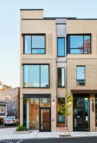 a front view of a building with a street