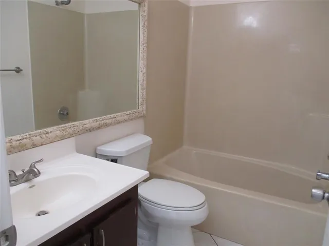 a bathroom with a sink toilet and bathtub