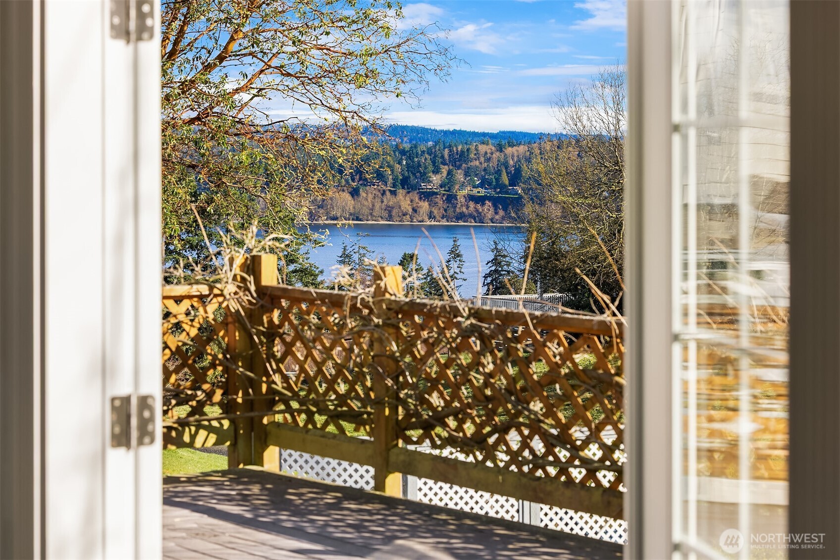 1316 East Backswing Lane Freeland, WA 98249 - Photo 3 of 37 a room with wooden floor and a potted plant
