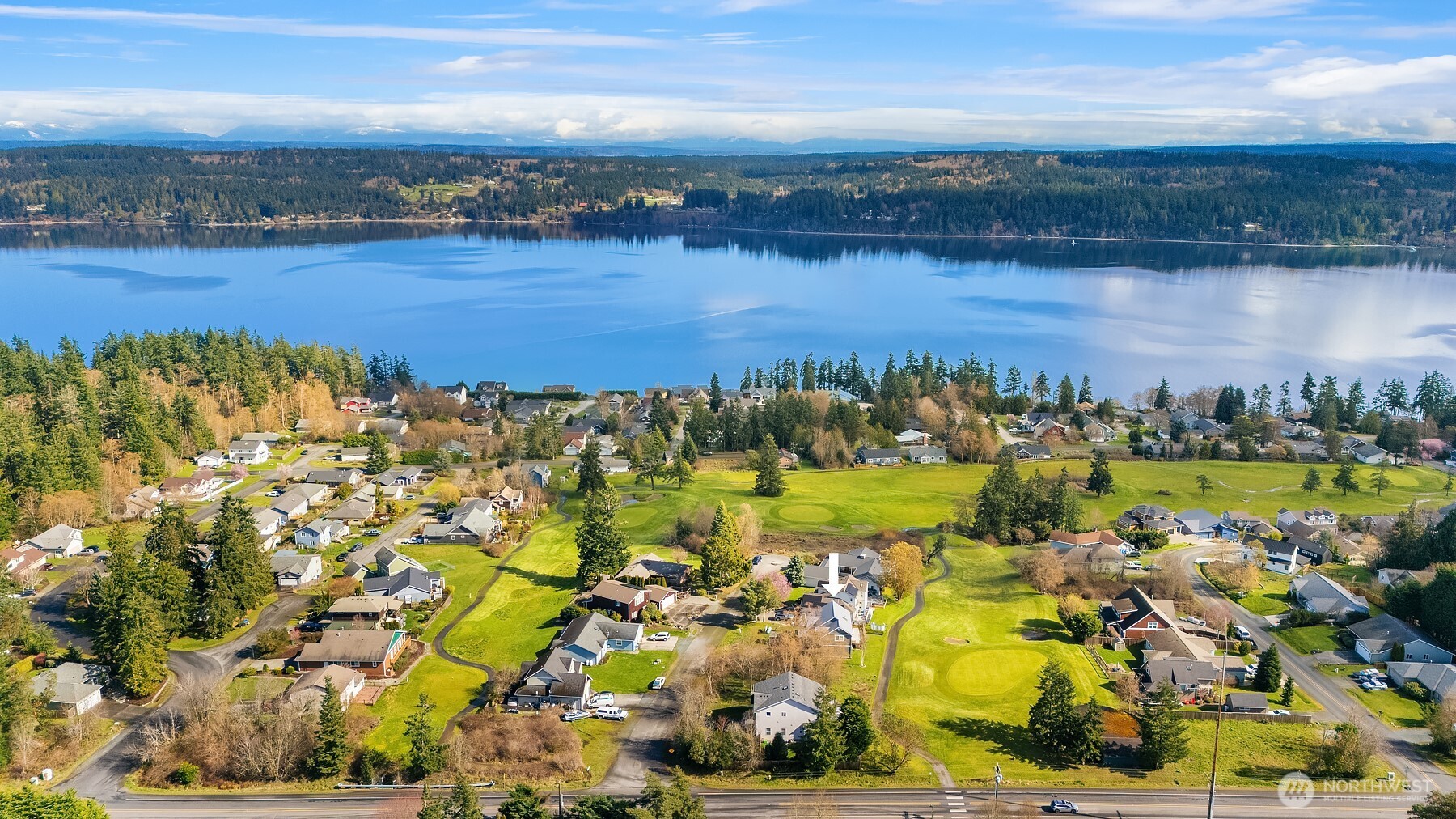 1316 East Backswing Lane Freeland, WA 98249 - Photo 5 of 37 a view of a lake with boats and trees all around