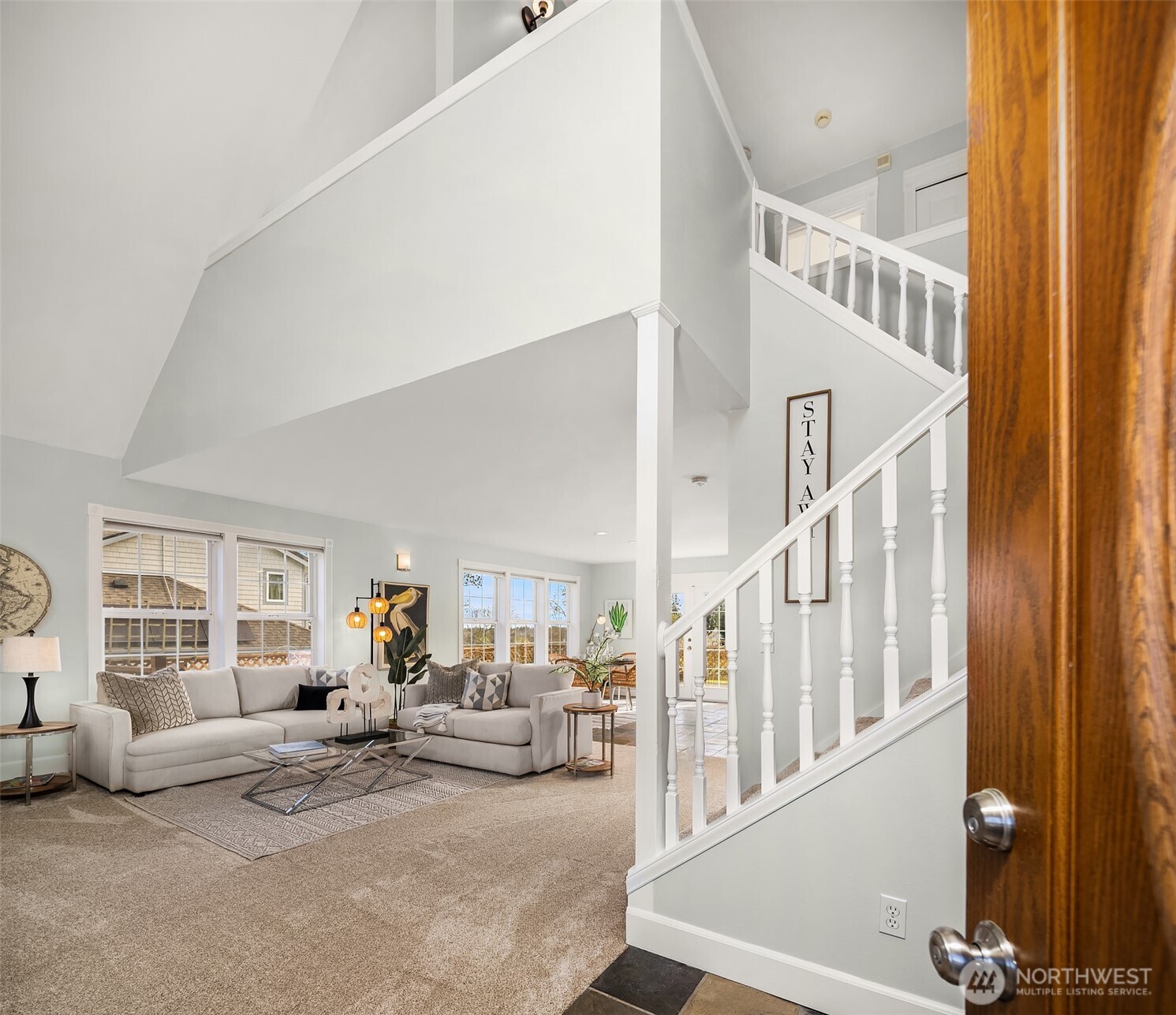 1316 East Backswing Lane Freeland, WA 98249 - Photo 7 of 37 a living room with furniture and stairs