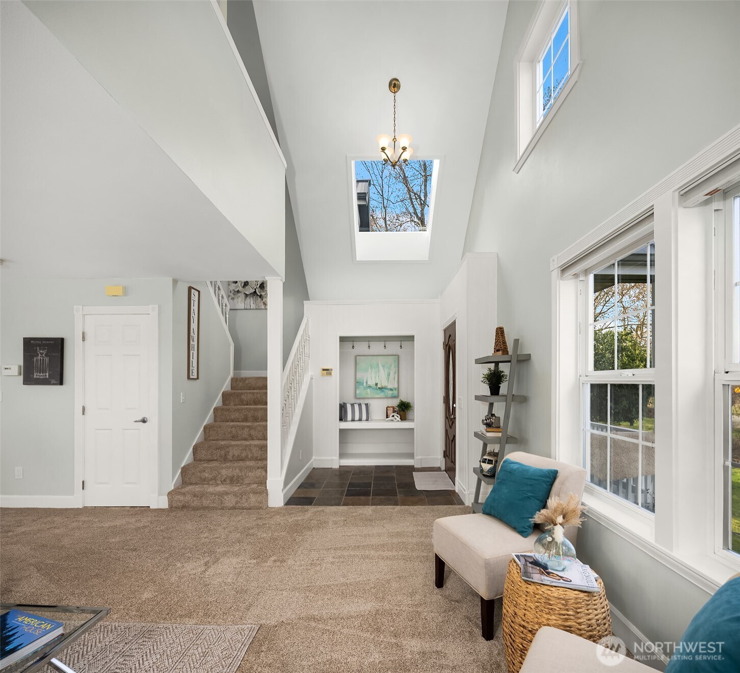 1316 East Backswing Lane Freeland, WA 98249 - Photo 10 of 37 a living room with furniture and a chandelier