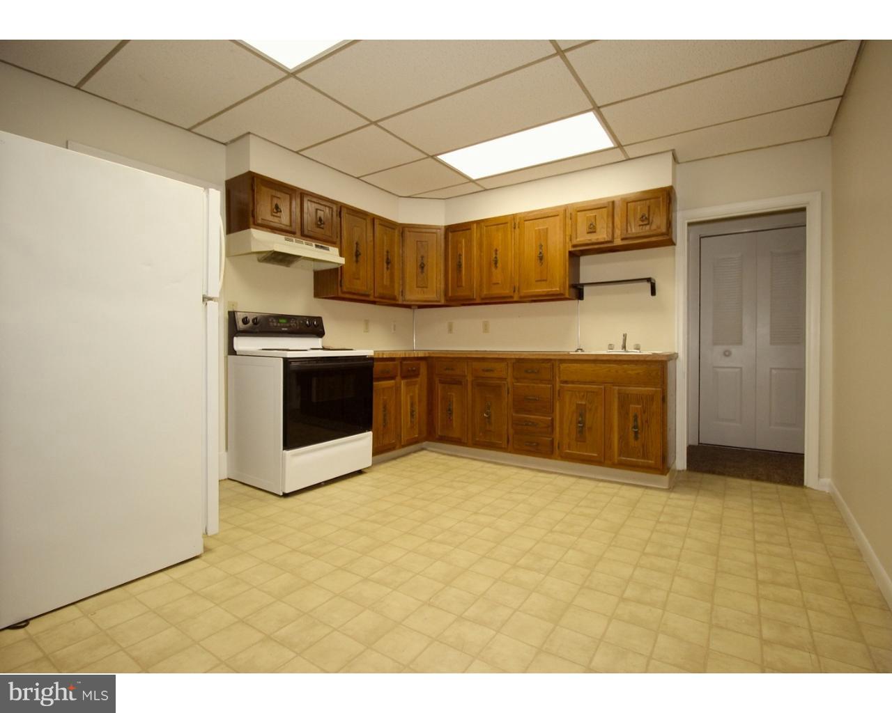 15 Level Road, Unit 3 Collegeville, PA 19426 - Photo 5 of 9 a kitchen with stainless steel appliances a sink and a stove