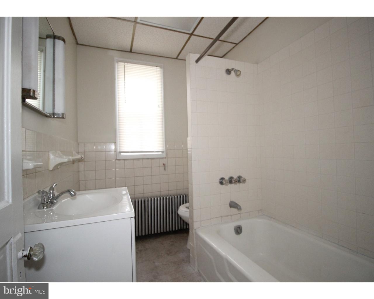 15 Level Road, Unit 3 Collegeville, PA 19426 - Photo 8 of 9 a bathroom with a bathtub sink vanity and mirror