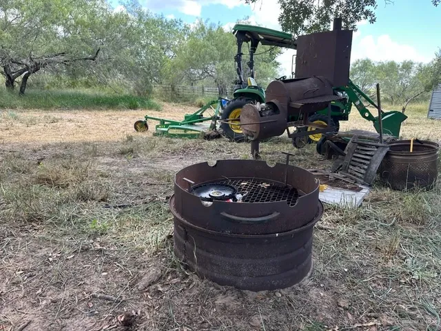 a view of a backyard with table and chairs potted plants