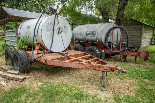 an aerial view of a backyard with table and chairs