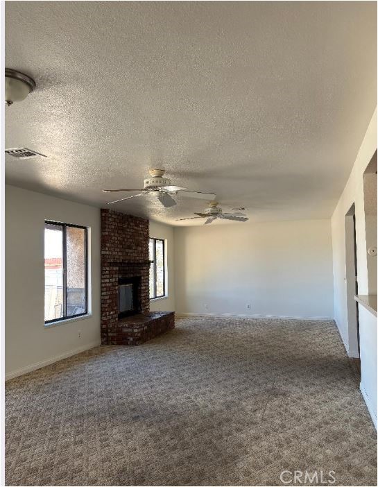 11556 3rd Hesperia, CA 92345 - Photo 11 of 24 an empty room with windows and fireplace