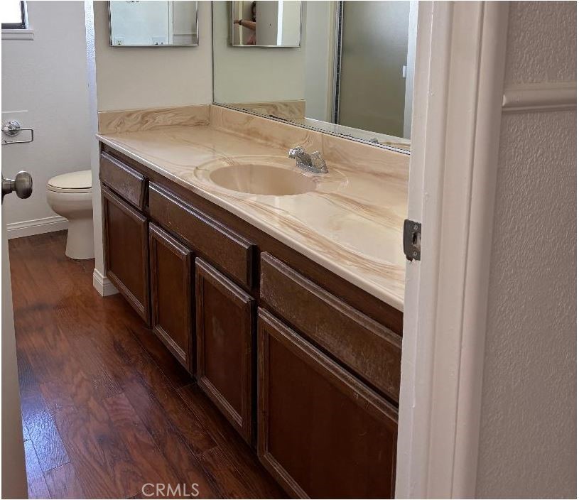 11556 3rd Hesperia, CA 92345 - Photo 20 of 24 a bathroom with a sink and mirror