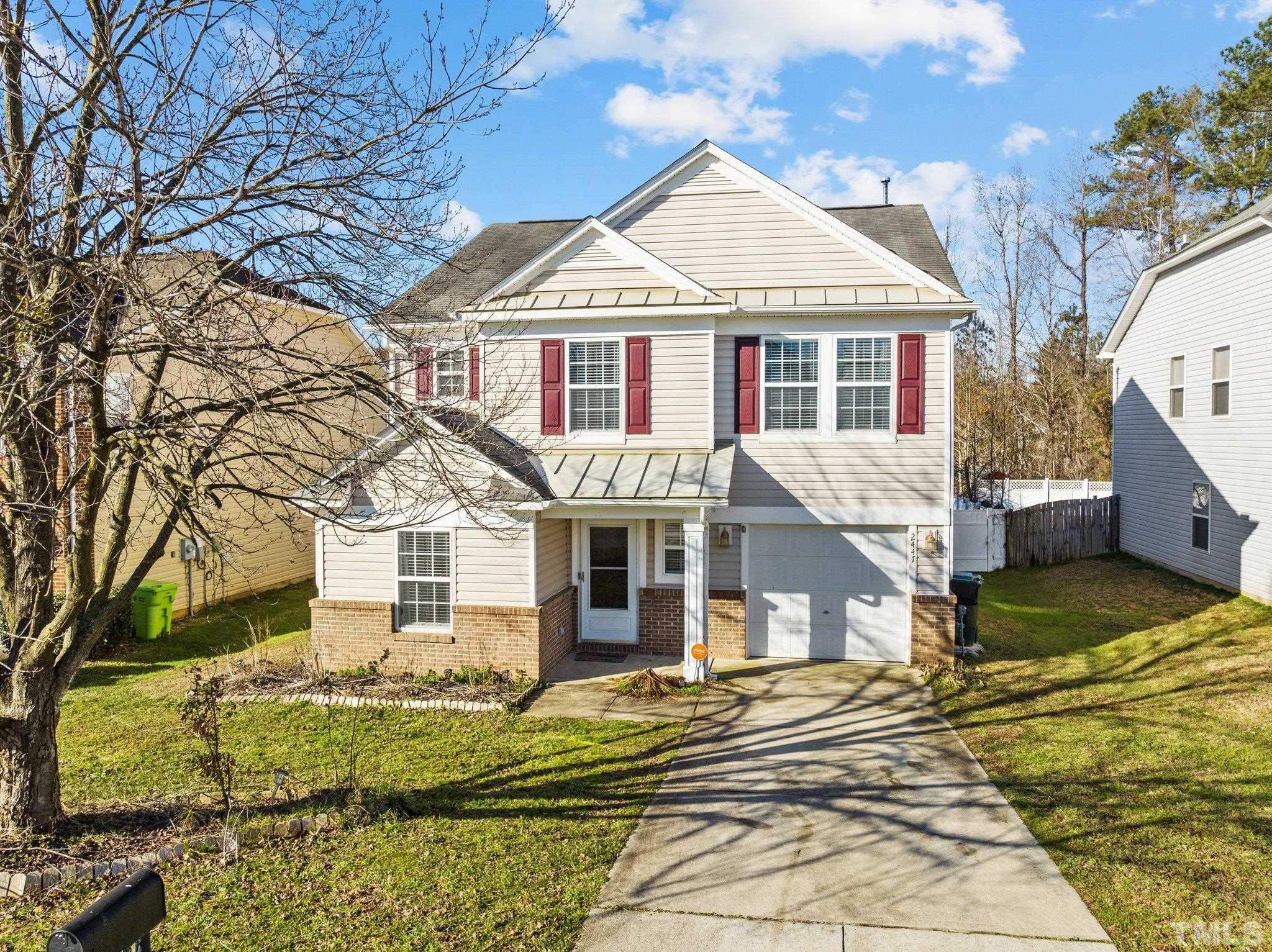 2447 Quarry Ridge Lane Raleigh, NC 27610 - Photo 1 of 44 a front view of a house with a yard