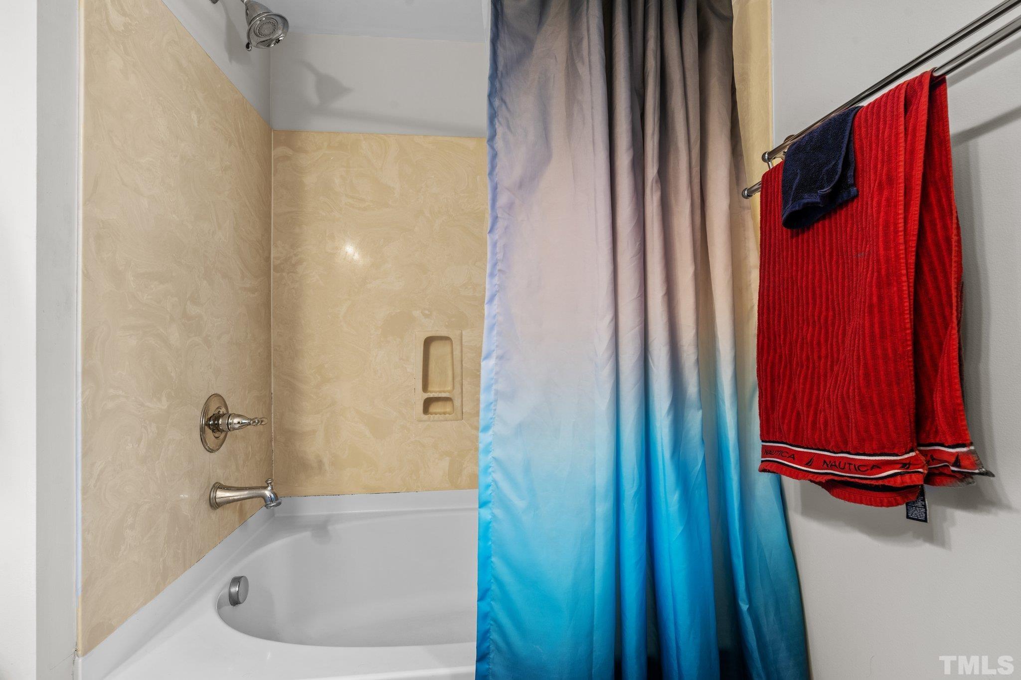 2447 Quarry Ridge Lane Raleigh, NC 27610 - Photo 23 of 44 a bathroom with a tub and shower
