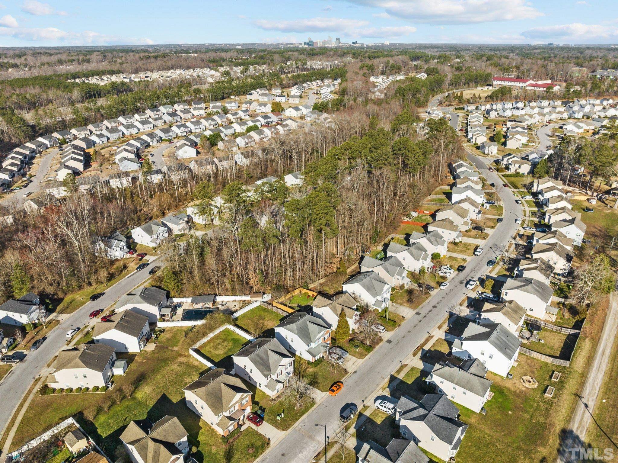 2447 Quarry Ridge Lane Raleigh, NC 27610 - Photo 41 of 44 an aerial view of residential building with parking space