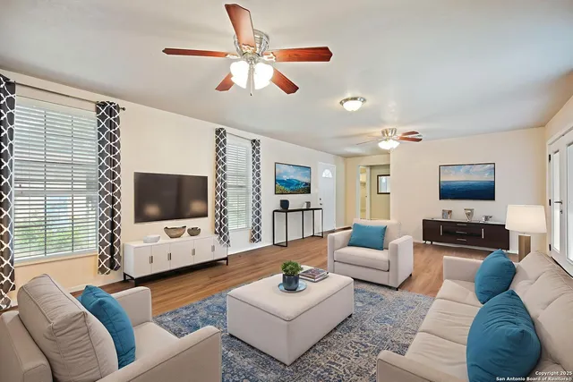 a living room with furniture and a flat screen tv