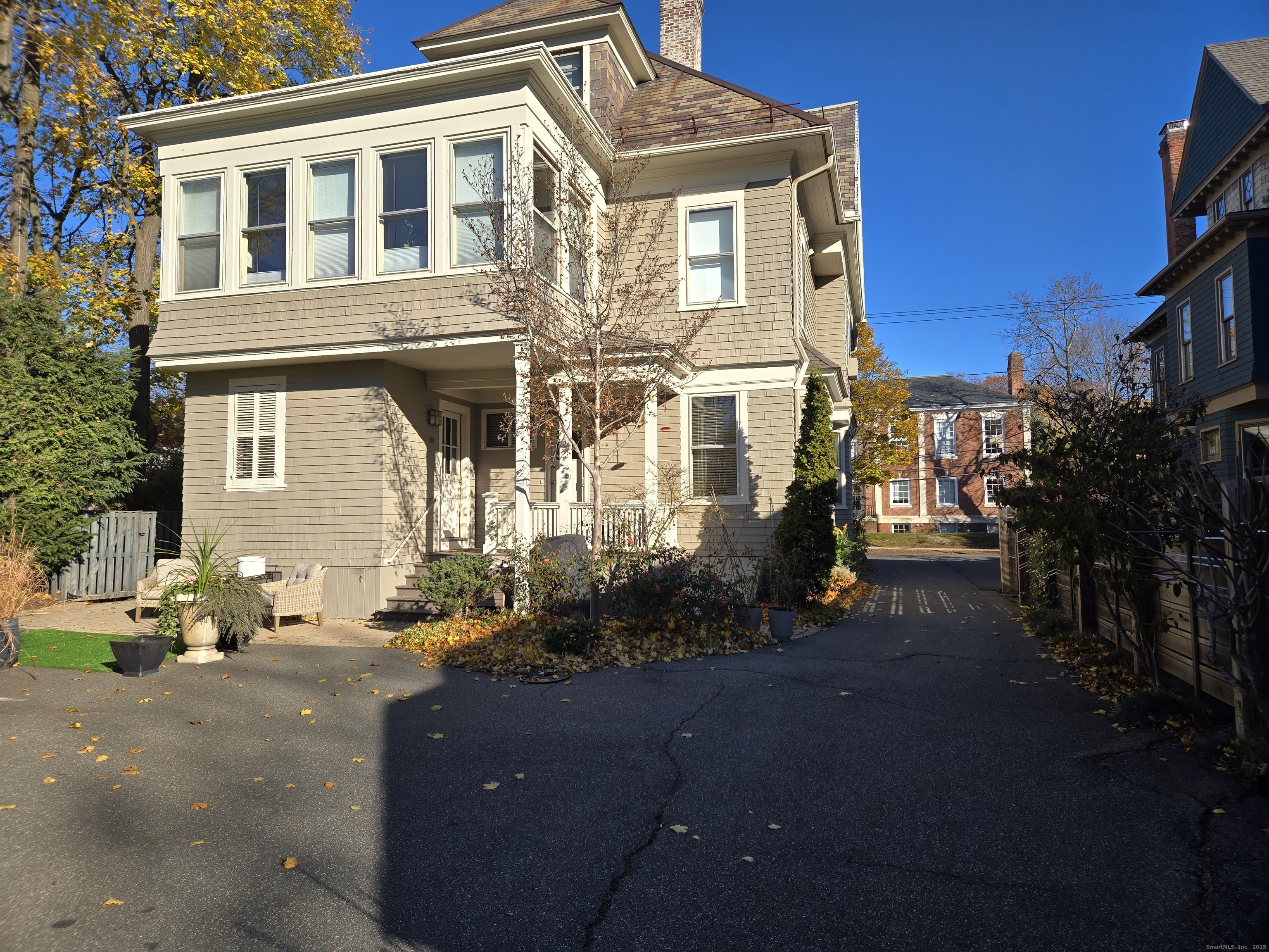 a front view of a house with trees