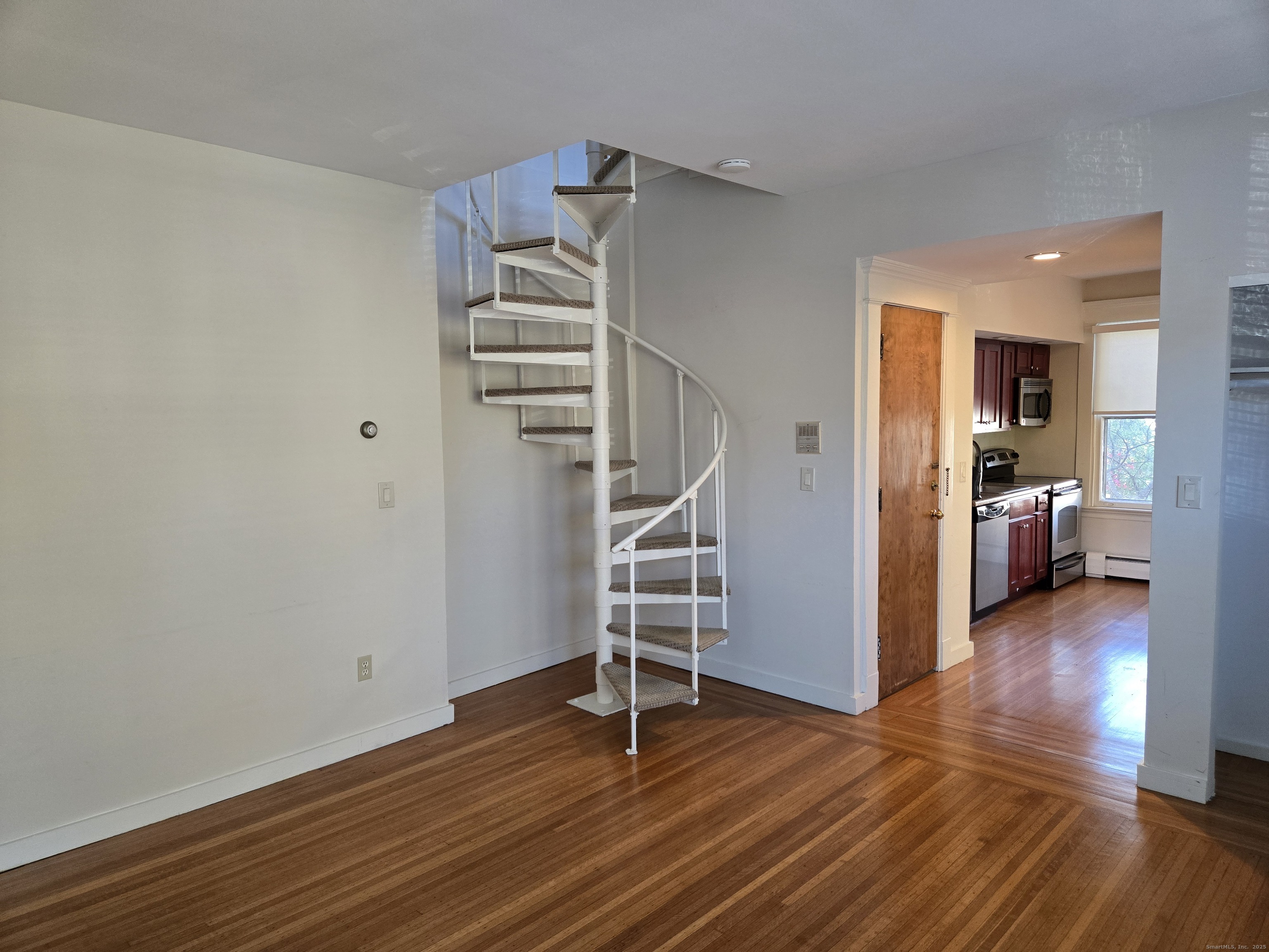 188 Cold Spring Street, Unit 3 New Haven, CT 06511 - Photo 11 of 20 a view of a room with wooden floor and stairs