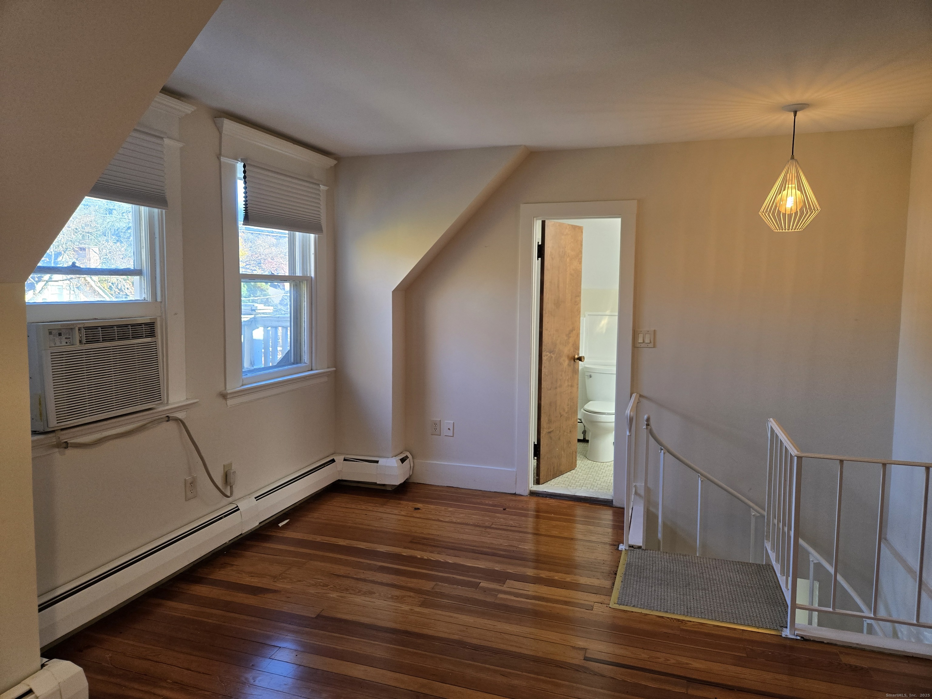 188 Cold Spring Street, Unit 3 New Haven, CT 06511 - Photo 16 of 20 a view of empty room with wooden floor and fan