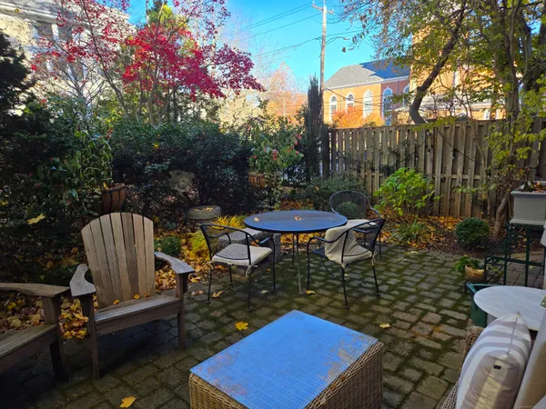 a view of a chairs and table in the patio
