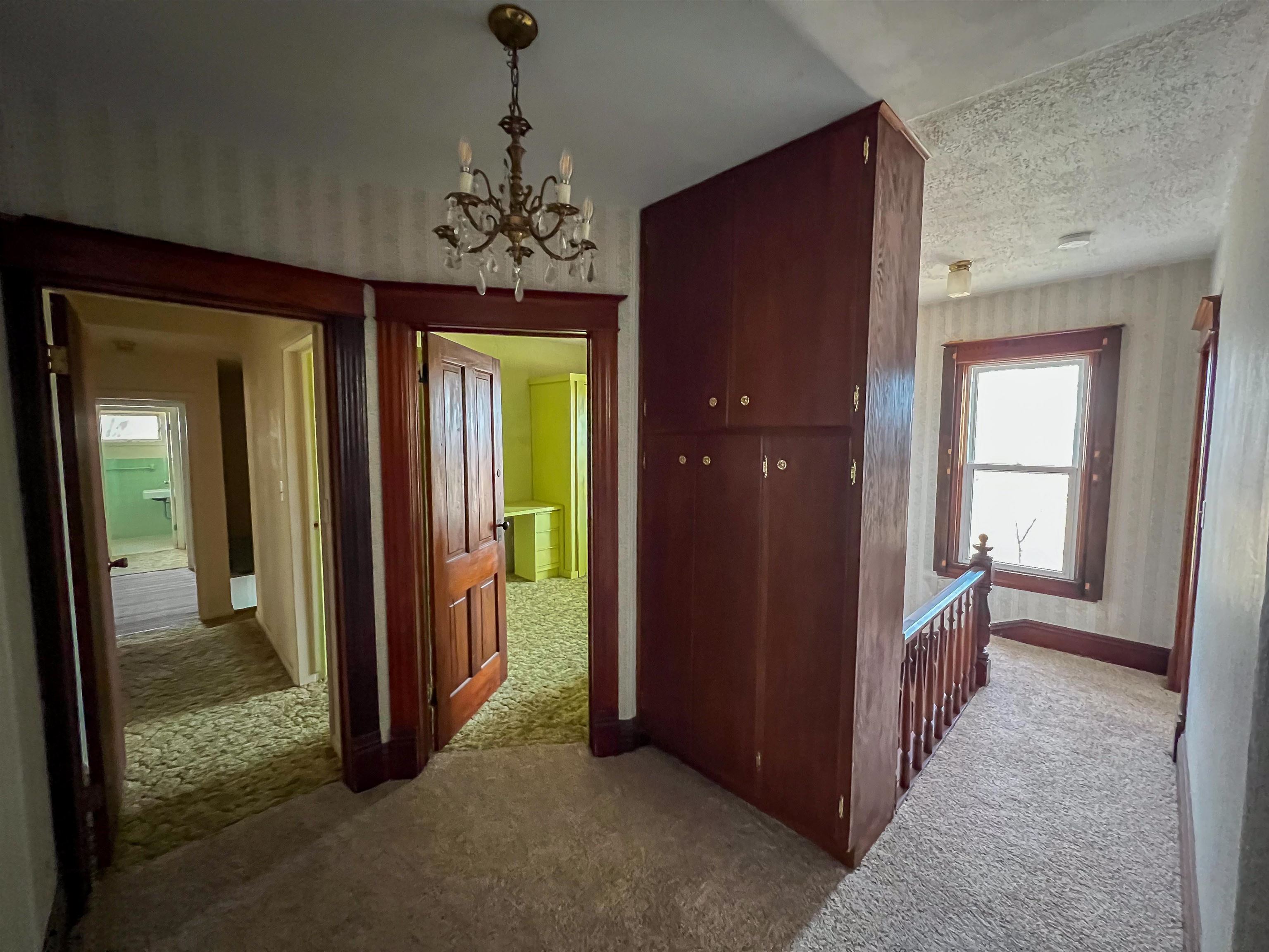3114 South Rush Creek Road Stockton, IL 61085 - Photo 27 of 76 an entryway at a room with a chandelier and closet