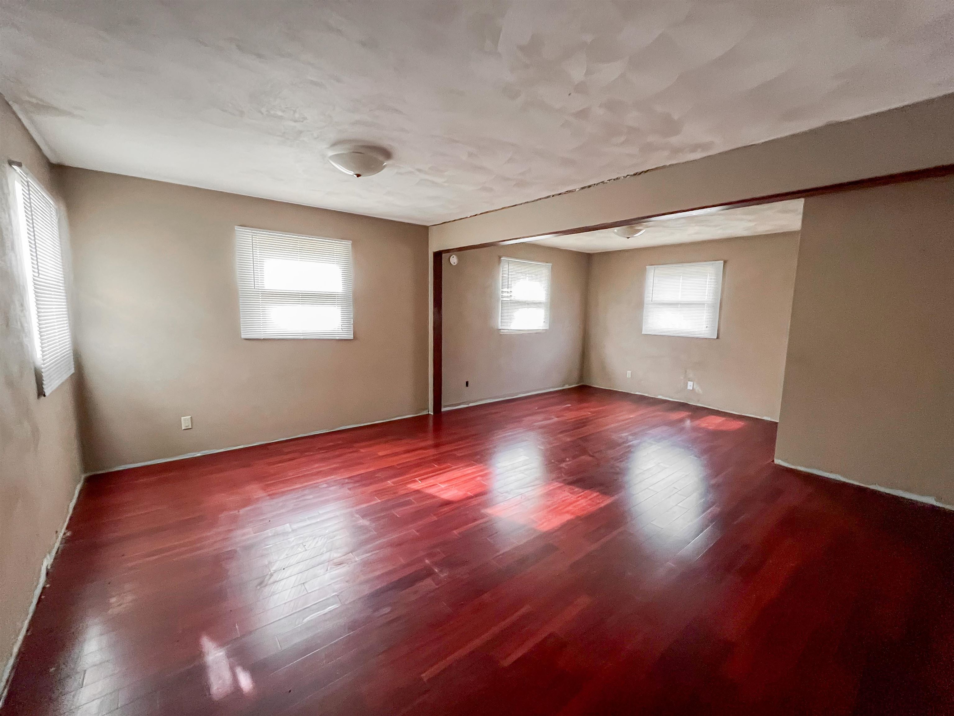 3114 South Rush Creek Road Stockton, IL 61085 - Photo 35 of 76 an empty room with wooden floor and windows