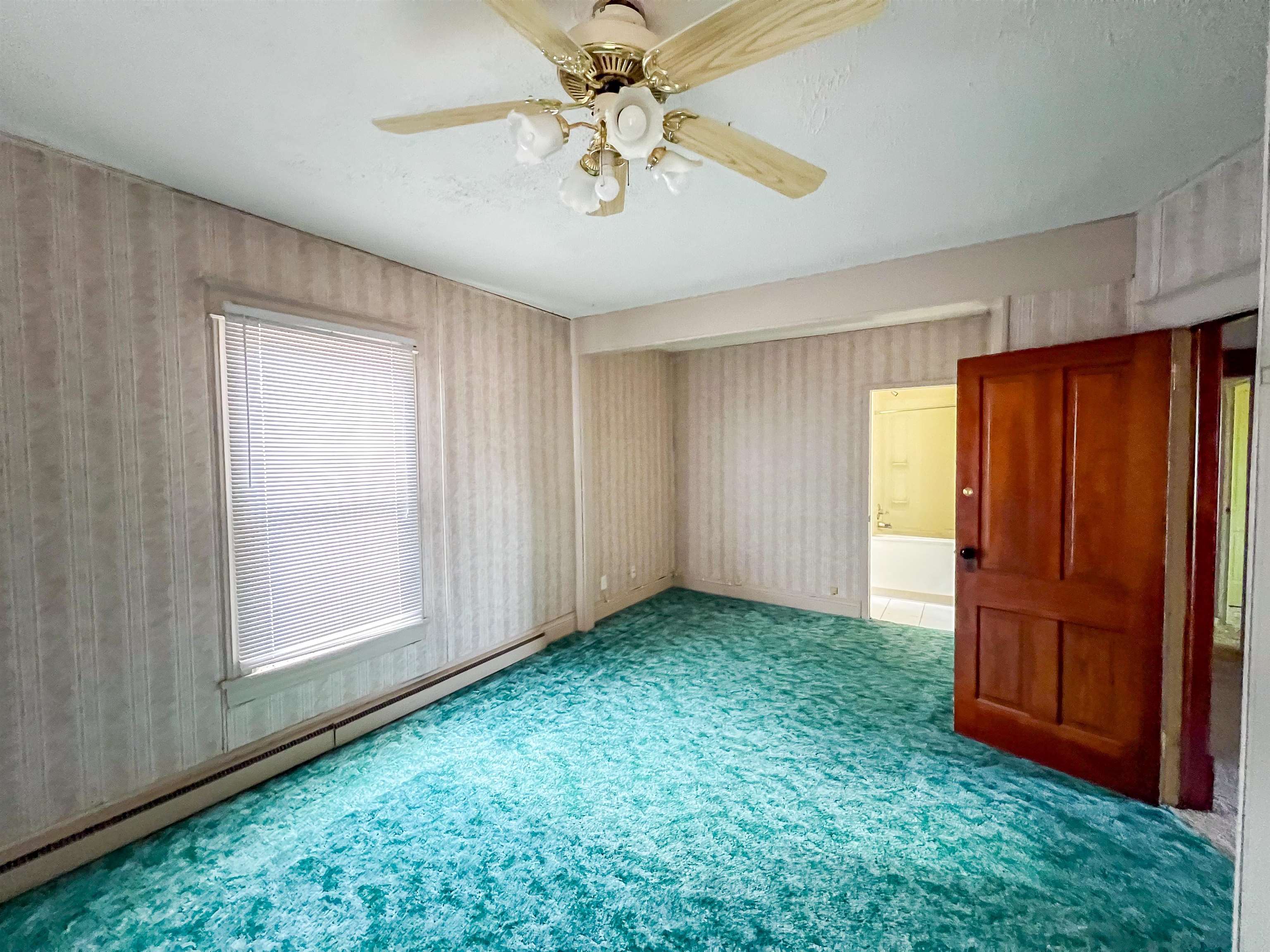 3114 South Rush Creek Road Stockton, IL 61085 - Photo 10 of 76 a view of an empty room with window and cabinet