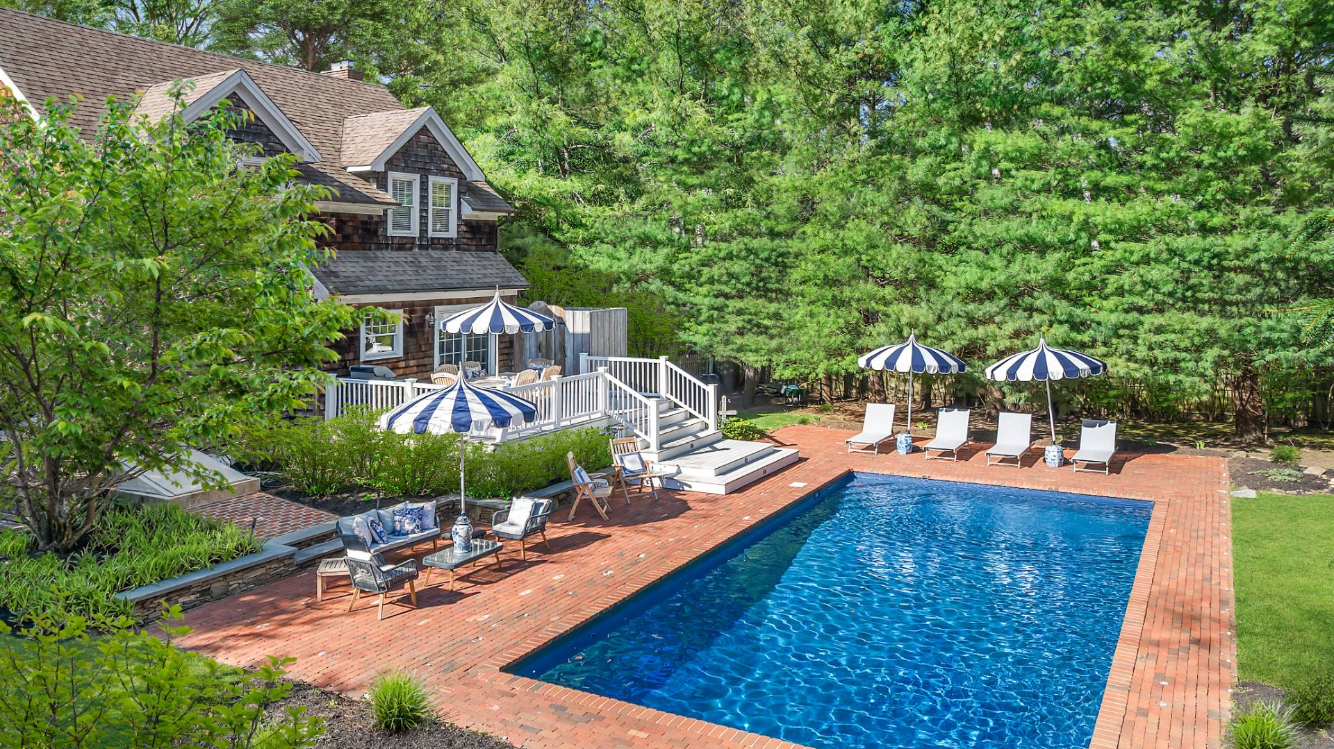 swimming pool view with a seating space