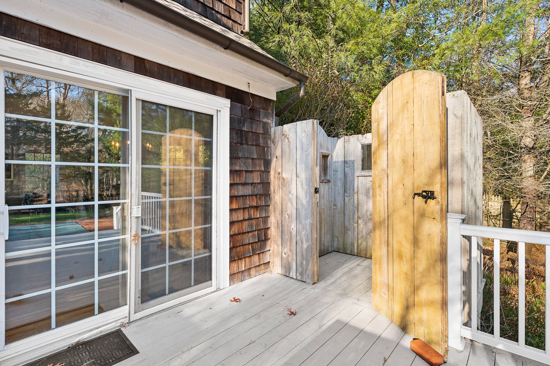63 Whooping Hollow Road East Hampton, NY 11937 - Photo 14 of 25 a view of a wooden door with a house