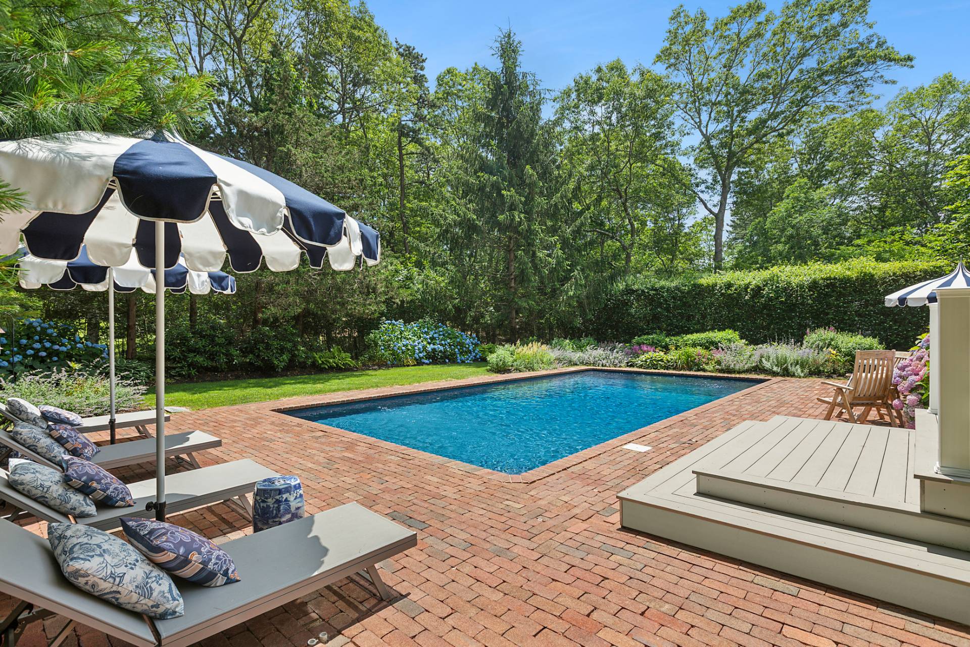 63 Whooping Hollow Road East Hampton, NY 11937 - Photo 16 of 25 a view of a patio with swimming pool