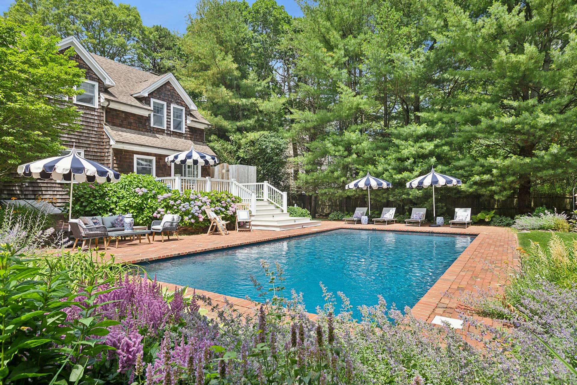 63 Whooping Hollow Road East Hampton, NY 11937 - Photo 20 of 25 a view of a house with a yard and sitting area