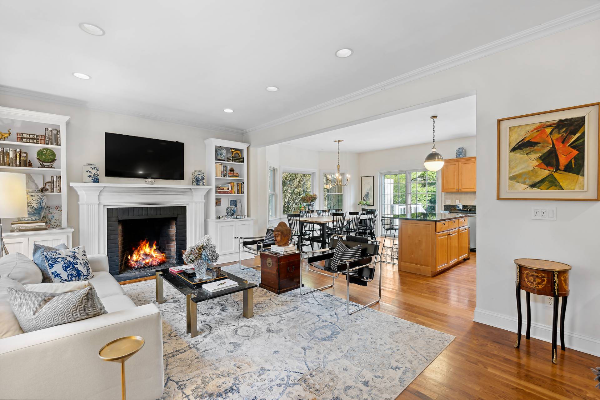 63 Whooping Hollow Road East Hampton, NY 11937 - Photo 4 of 25 a living room with furniture fireplace and flat screen tv