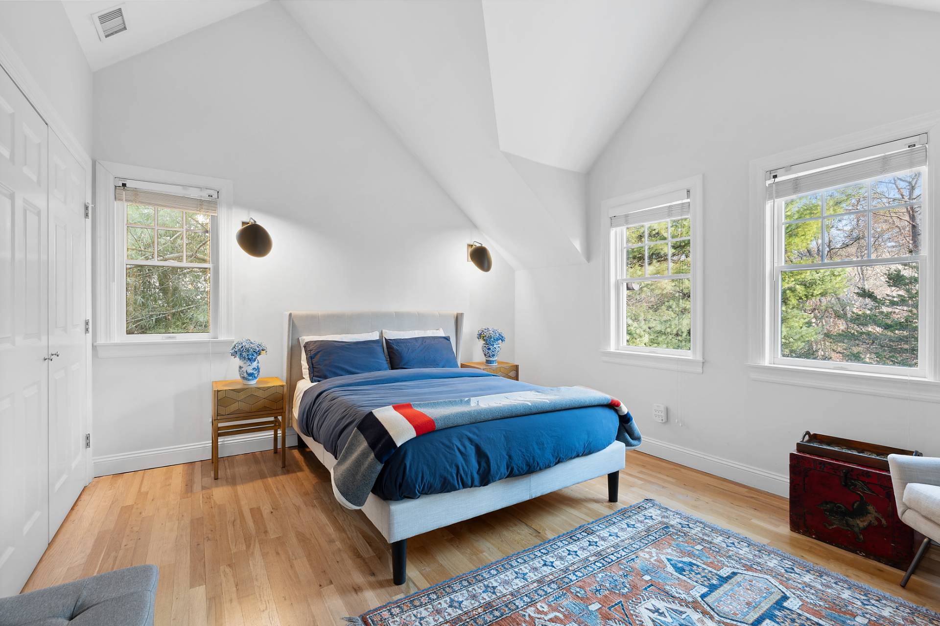 63 Whooping Hollow Road East Hampton, NY 11937 - Photo 7 of 25 a bed room with a bed and a couch