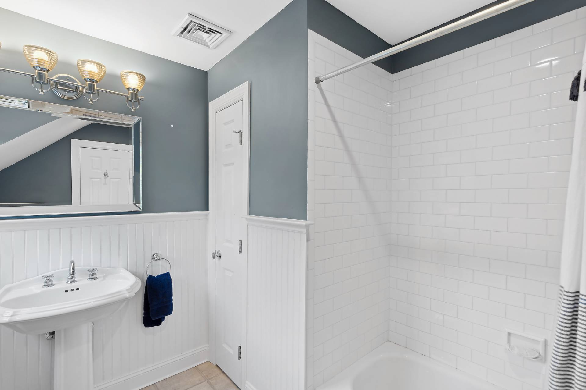 63 Whooping Hollow Road East Hampton, NY 11937 - Photo 8 of 25 a bathroom with a sink and mirror